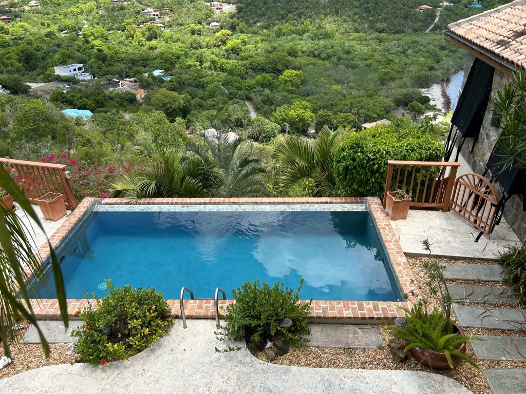 Hillside pool and timber deck overlooking the harbour, St. John, USVI