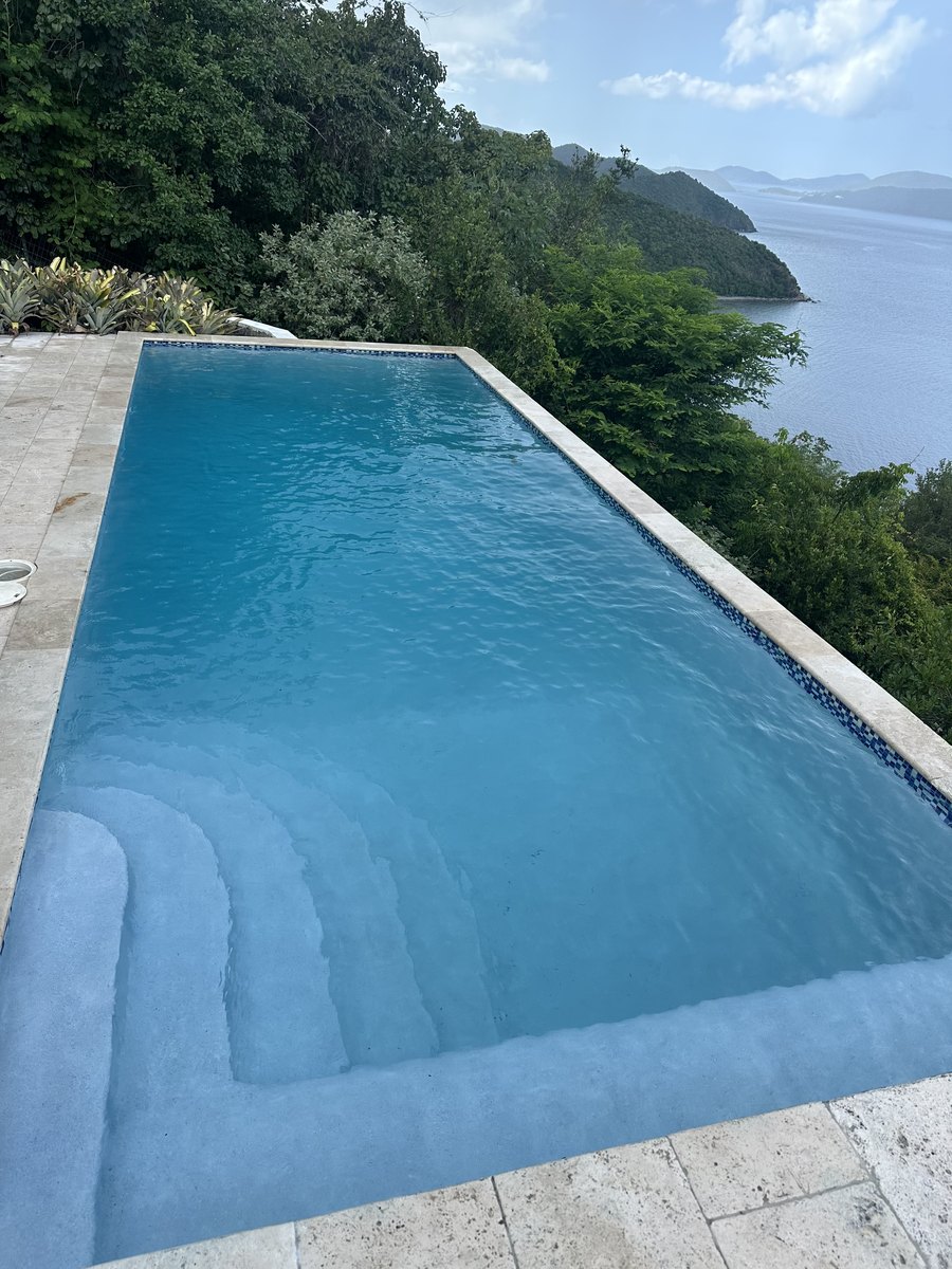 Infinity-edge pool with entry steps above the bay, St. John, USVI